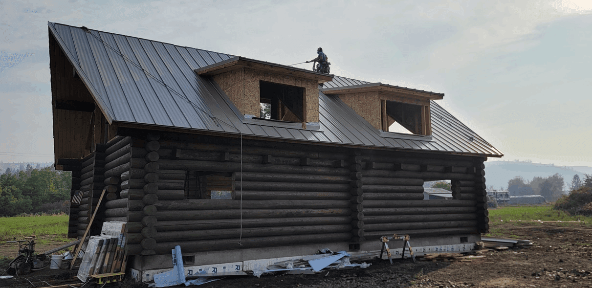 Photo Spanaway Roofing Working on Dark Roof Cabing