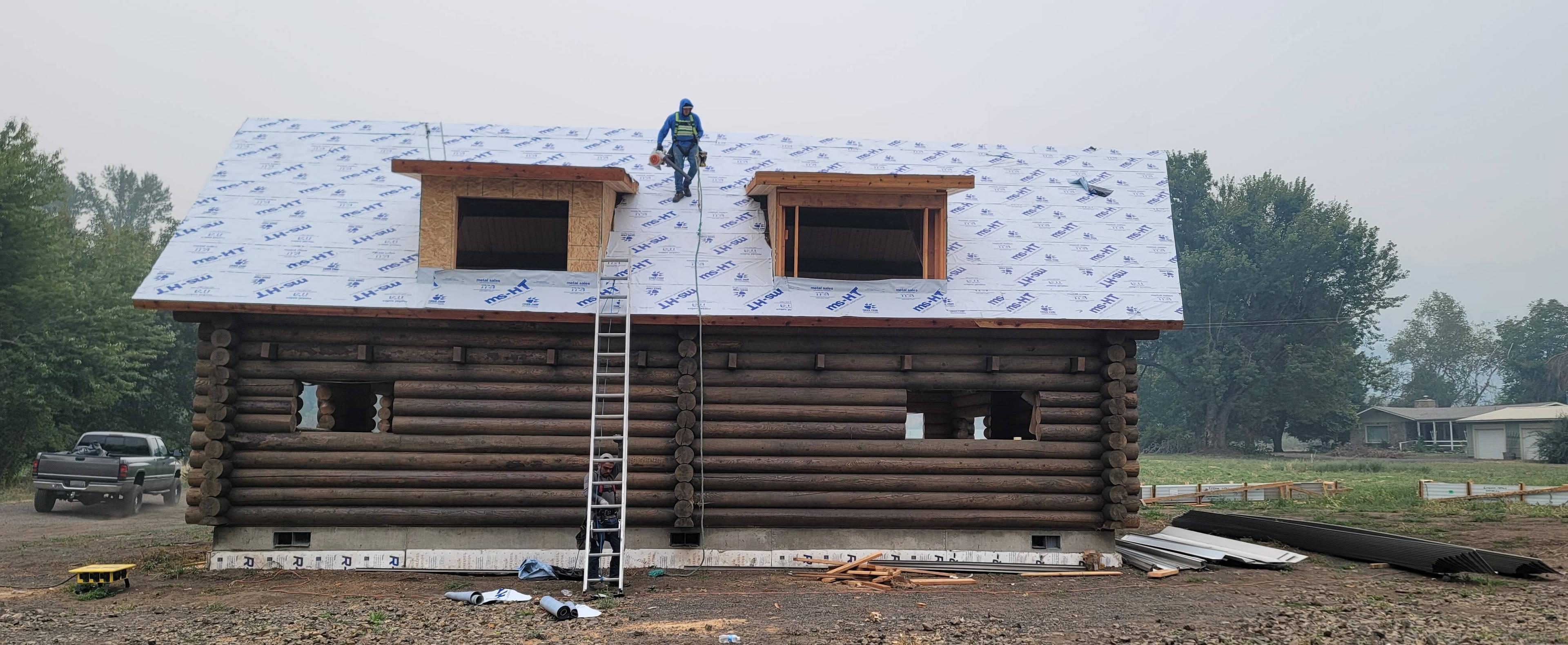 Spanaway Roofing Working on Cabin in top